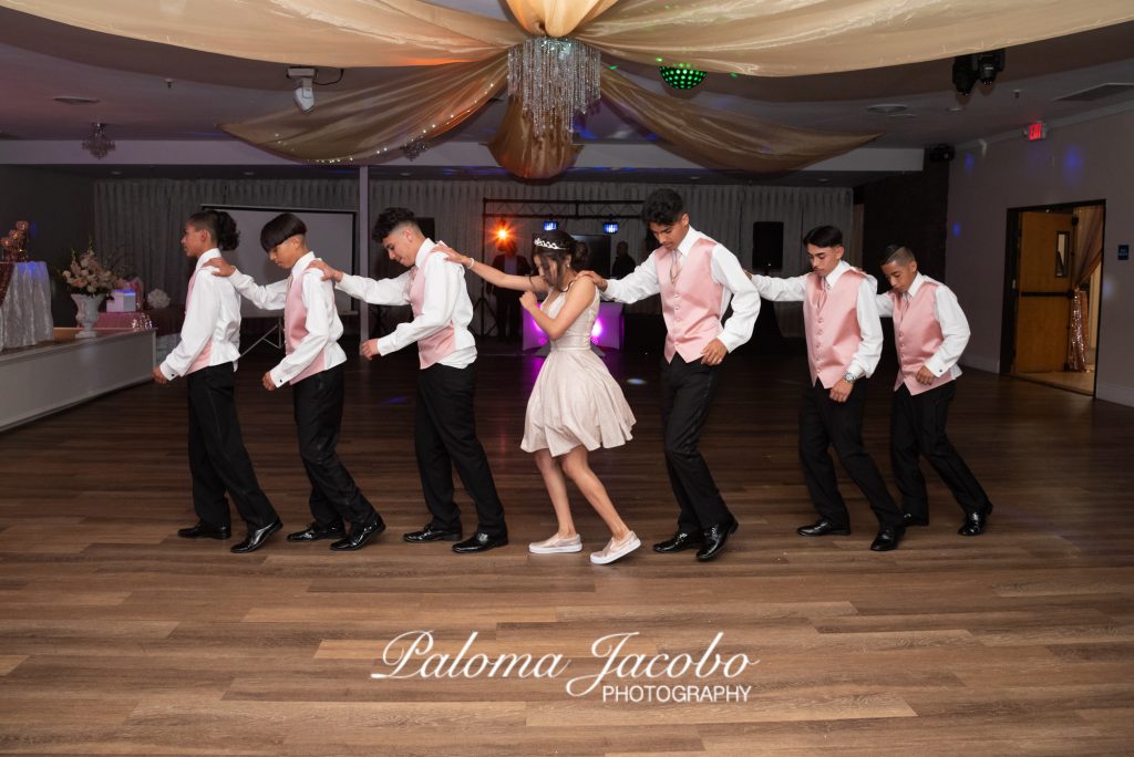 Quinceanera  dancing surprise dance with Chanbelanes at Reception at Boulevard Hall. San Diego Quinceanera Photography by Paloma Jacobo