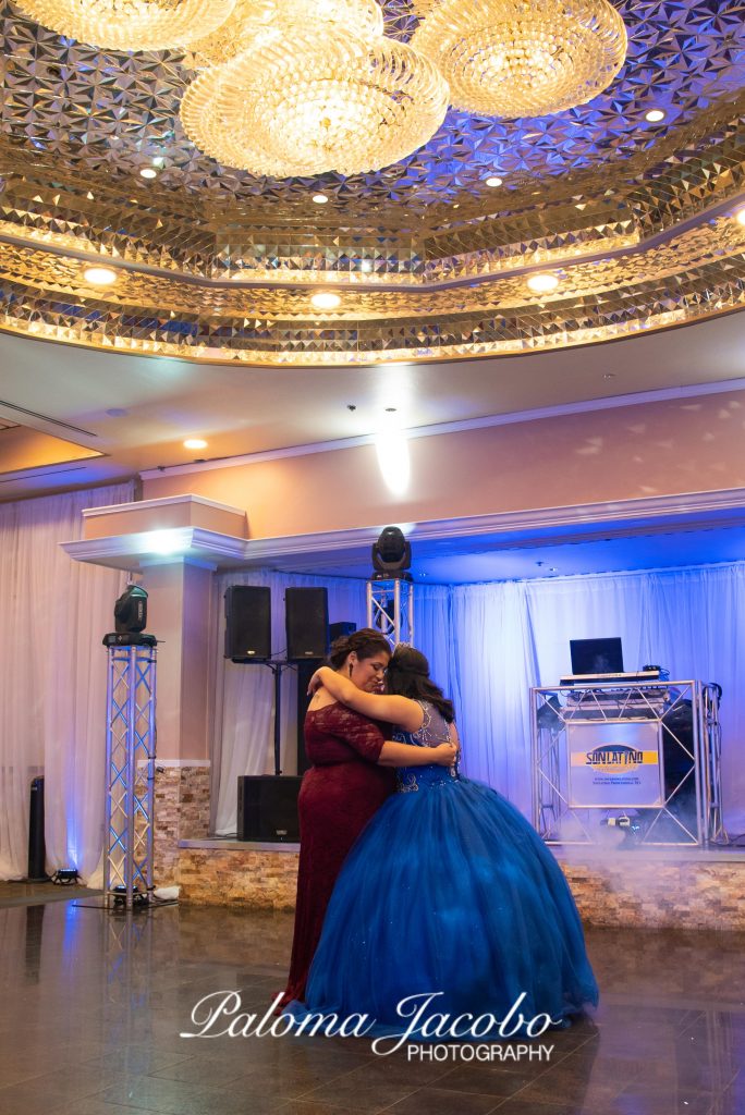 Quinceanera dancing to one of the top 5 songs for a quinceanera party by Paloma Jacobo Photography