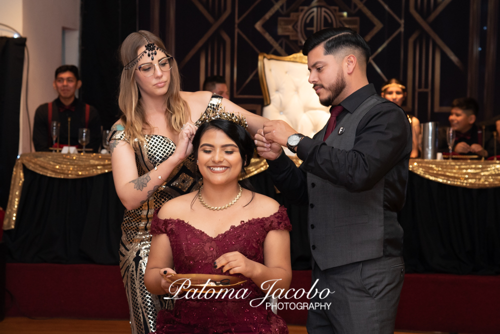 Quinceanera during crowning ceremony by Paloma Jacobo Photography