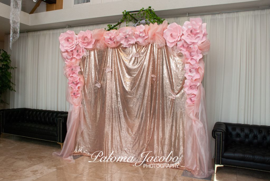 Quinceanera backdrop at the entrance of Boulevard Hall by Paloma Jacobo Photography