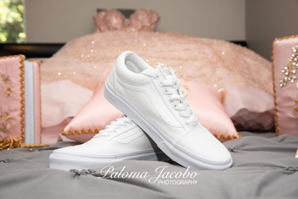 Quinceanera white sneakers with blush pink dress on the foreground by Paloma Jacobo Photography