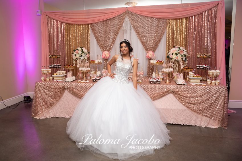 Quinceanera posing at reception in San Diego CA by Paloma Jacobo Photography