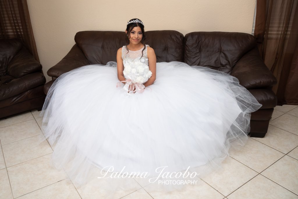 Quincearea sitting down. San Diego Quinceanera Photography by Paloma Jacobo