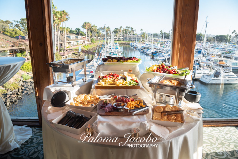 Charcuterie board setup for a Quinceanera party by the ocean