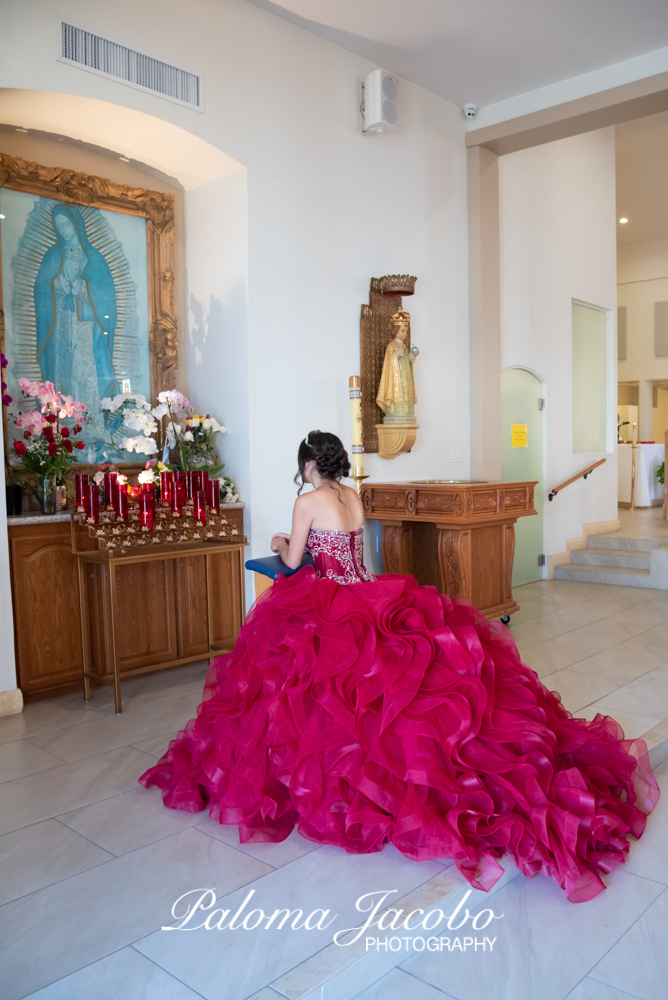 Quinceanera offering flowers to the virgin by Paloma Jacobo Photography