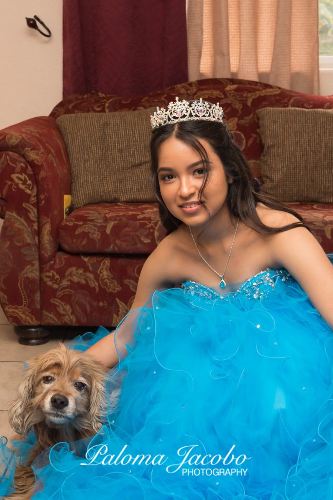 Quinceanera posing with her dog by Paloma Jacobo Photography