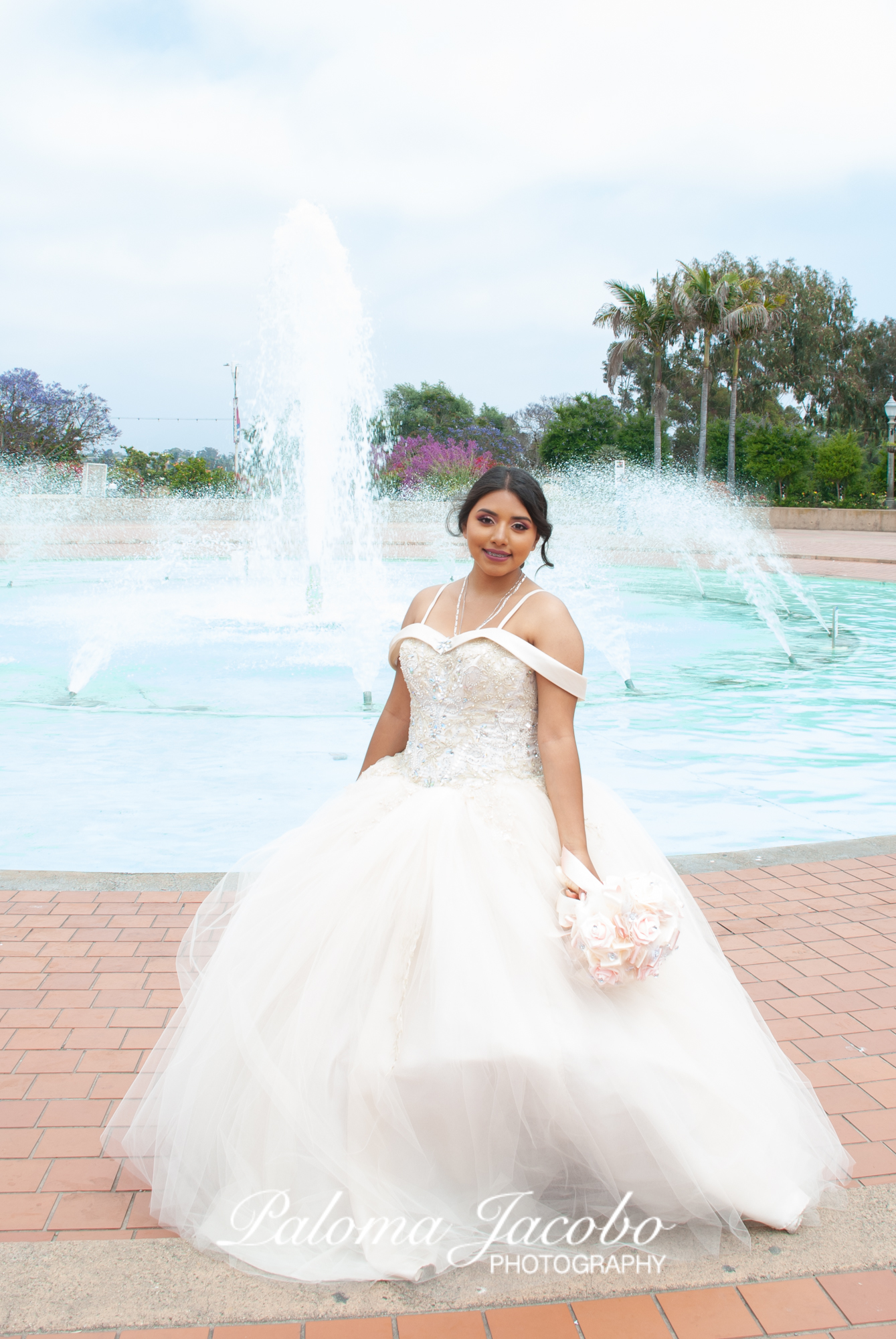 Quinceanera pictures by the fountain in Balboa Park by Paloma Jacobo Photography