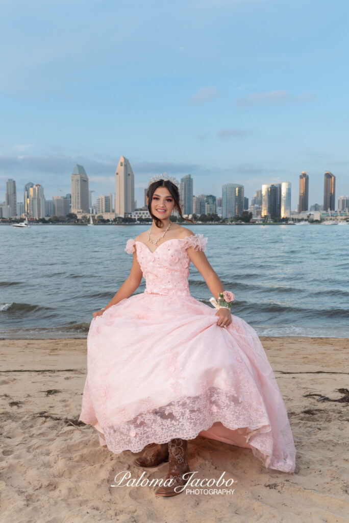 Quinceanera showing off her boots under the quince dress