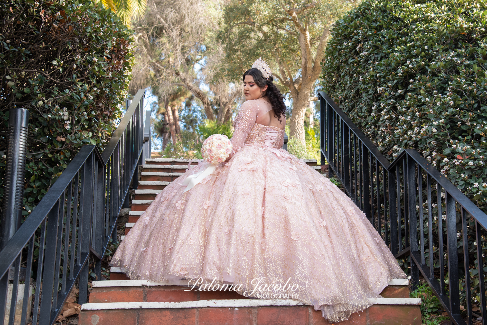 Quinceanera picture where she is looking down at her flowers